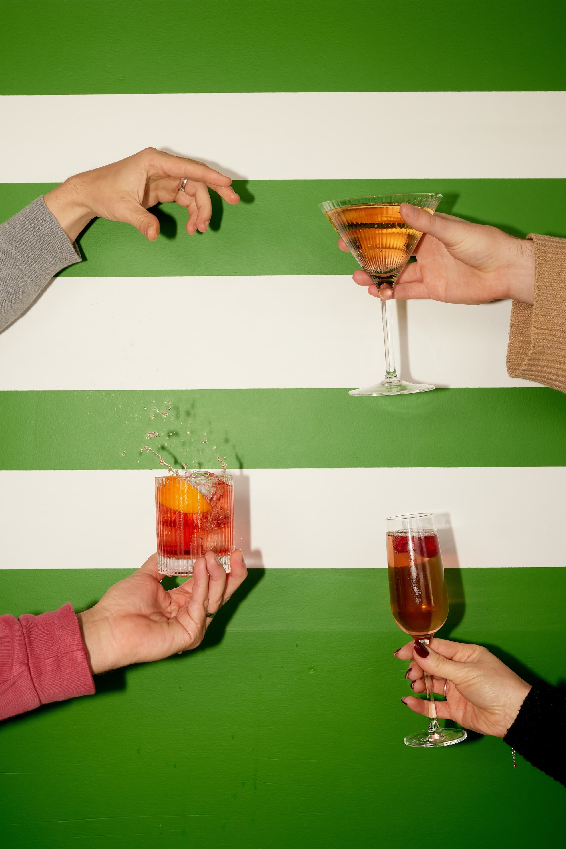 hands holding drinks